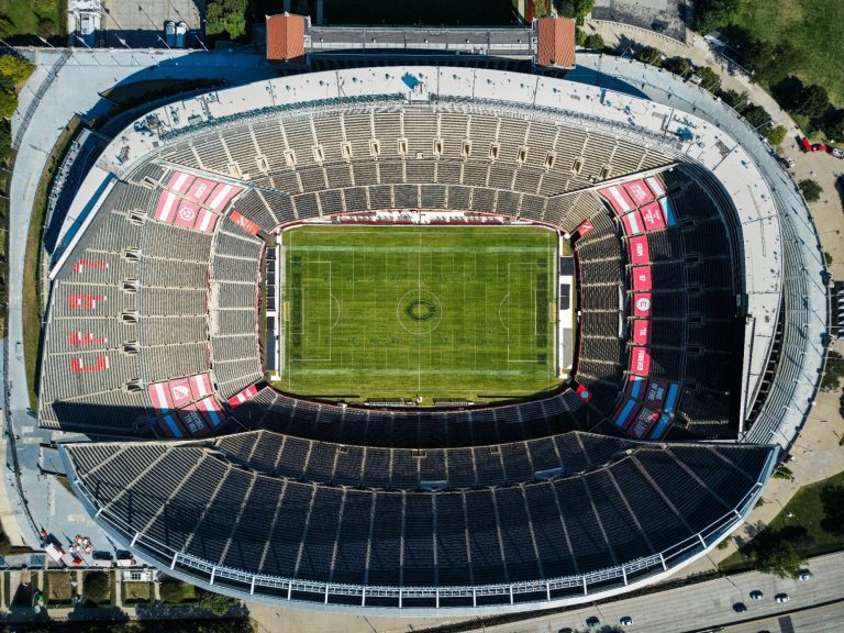 Aerial view of a large outdoor stadium with a field and surrounding seating